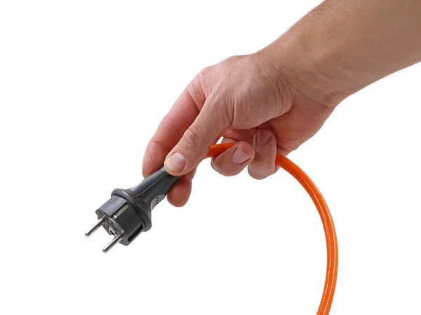 yakın, erkek el beyaz arka plan üzerinde izole fiş ile turuncu elektrik kablosu tutan