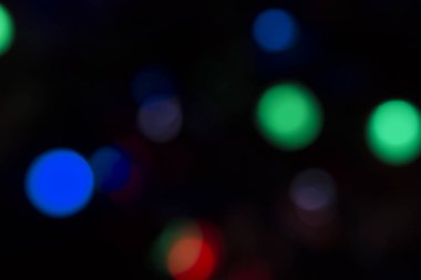 Soyut renkli, odaklanmış dairesel fakül. Bokeh bulanık renk ışığı arka planı kullanabilir. Yeni yıl Bokeh feshi