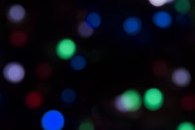 Soyut renkli, odaklanmış dairesel fakül. Bokeh bulanık renk ışığı arka planı kullanabilir. Yeni yıl Bokeh feshi