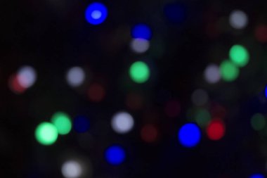 Soyut renkli, odaklanmış dairesel fakül. Bokeh bulanık renk ışığı arka planı kullanabilir. Yeni yıl Bokeh feshi
