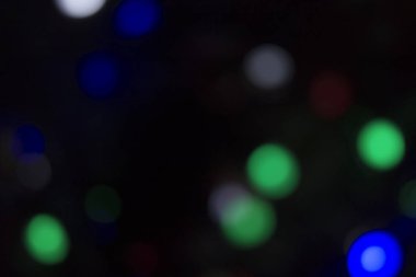 Soyut renkli, odaklanmış dairesel fakül. Bokeh bulanık renk ışığı arka planı kullanabilir. Yeni yıl Bokeh feshi