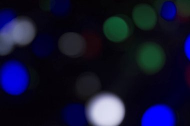 Soyut renkli, odaklanmış dairesel fakül. Bokeh bulanık renk ışığı arka planı kullanabilir. Yeni yıl Bokeh feshi