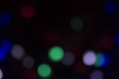 Soyut renkli, odaklanmış dairesel fakül. Bokeh bulanık renk ışığı arka planı kullanabilir. Yeni yıl Bokeh feshi