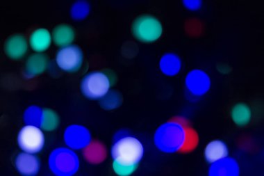 Soyut renkli, odaklanmış dairesel fakül. Bokeh bulanık renk ışığı arka planı kullanabilir. Yeni yıl Bokeh feshi