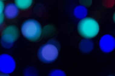Soyut renkli, odaklanmış dairesel fakül. Bokeh bulanık renk ışığı arka planı kullanabilir. Yeni yıl Bokeh feshi