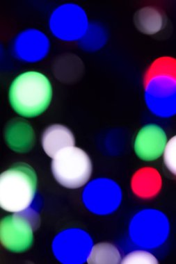 Soyut renkli, odaklanmış dairesel fakül. Bokeh bulanık renk ışığı arka planı kullanabilir. Yeni yıl Bokeh feshi