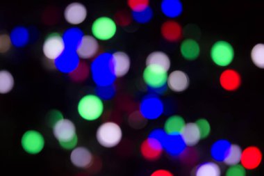 Soyut renkli, odaklanmış dairesel fakül. Bokeh bulanık renk ışığı arka planı kullanabilir. Yeni yıl Bokeh feshi