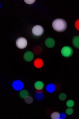 Soyut renkli, odaklanmış dairesel fakül. Bokeh bulanık renk ışığı arka planı kullanabilir. Yeni yıl Bokeh feshi