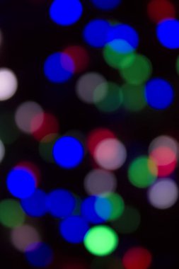 Soyut renkli, odaklanmış dairesel fakül. Bokeh bulanık renk ışığı arka planı kullanabilir. Yeni yıl Bokeh feshi