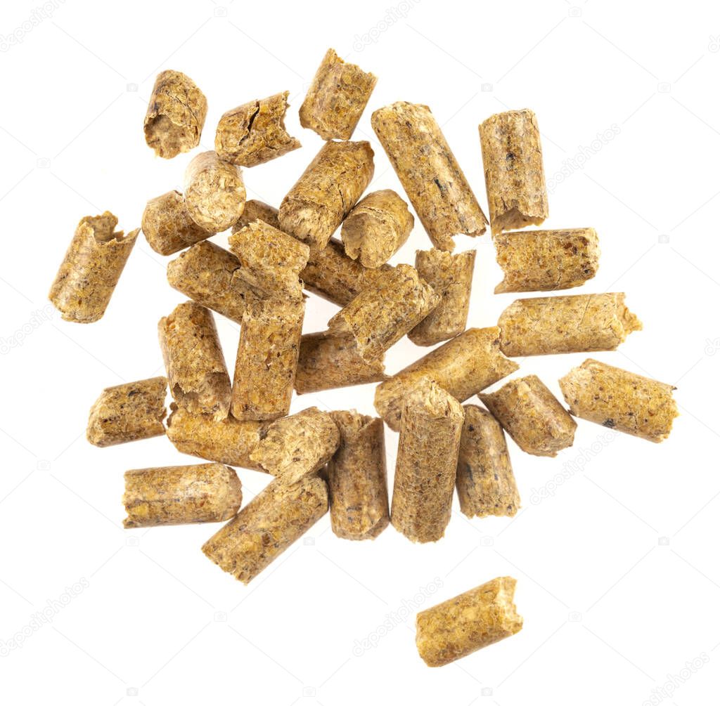 Brown wood pellets  isolated white background. natural pile of wood pellets. organic biofuels texture. Alternative biofuel from sawdust. The cat litter. pile of compressed wood pellets.