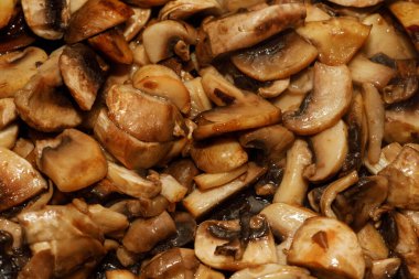 Arka plan dokusunda kızartılmış şampiyon mantarları