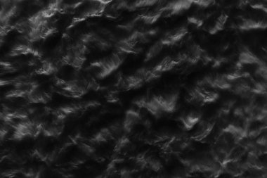 Üst bej desenli siyah gerçek yün. Kara doğal koyun yünü. Pürüzsüz pamuk, tasarımcılar için tüylü kürk dokusu 
