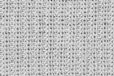 Örgü yün kumaş arka planının beyaz doğal dokusu. Beyaz pamuk kumaş, örülmüş tuval dokusu