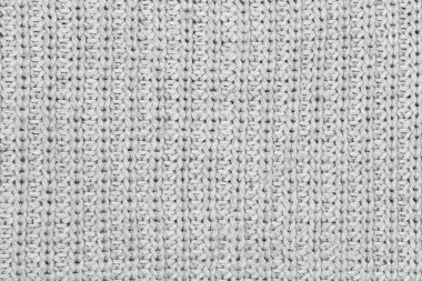 Örgü yün kumaş arka planının beyaz doğal dokusu. Beyaz pamuk kumaş, örülmüş tuval dokusu