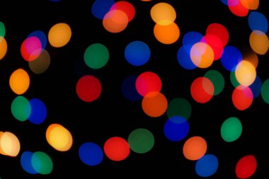 Soyut renkli, odaklanmış dairesel fakül. Bokeh bulanık renk ışığı arka planı kullanabilir. Yeni yıl Bokeh feshi