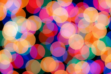 Soyut renkli, odaklanmış dairesel fakül. Bokeh bulanık renk ışığı arka planı kullanabilir. Yeni yıl Bokeh feshi