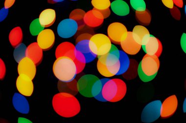 Soyut renkli, odaklanmış dairesel fakül. Bokeh bulanık renk ışığı arka planı kullanabilir. Yeni yıl Bokeh feshi