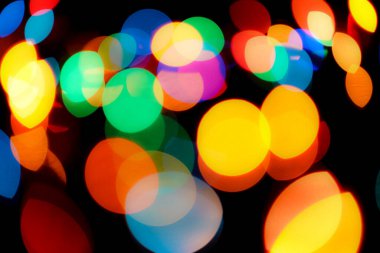 Soyut renkli, odaklanmış dairesel fakül. Bokeh bulanık renk ışığı arka planı kullanabilir. Yeni yıl Bokeh feshi