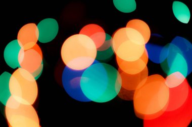 Soyut renkli, odaklanmış dairesel fakül. Bokeh bulanık renk ışığı arka planı kullanabilir. Yeni yıl Bokeh feshi