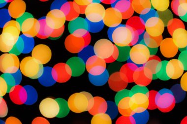 Soyut renkli, odaklanmış dairesel fakül. Bokeh bulanık renk ışığı arka planı kullanabilir. Yeni yıl Bokeh feshi