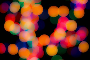 Soyut renkli, odaklanmış dairesel fakül. Bokeh bulanık renk ışığı arka planı kullanabilir. Yeni yıl Bokeh feshi