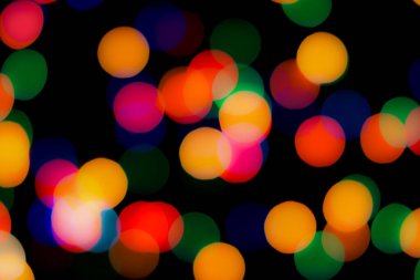 Soyut renkli, odaklanmış dairesel fakül. Bokeh bulanık renk ışığı arka planı kullanabilir. Yeni yıl Bokeh feshi