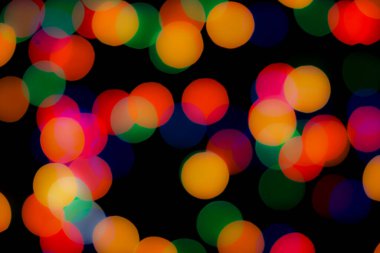 Soyut renkli, odaklanmış dairesel fakül. Bokeh bulanık renk ışığı arka planı kullanabilir. Yeni yıl Bokeh feshi