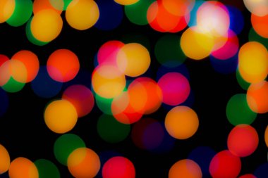 Soyut renkli, odaklanmış dairesel fakül. Bokeh bulanık renk ışığı arka planı kullanabilir. Yeni yıl Bokeh feshi