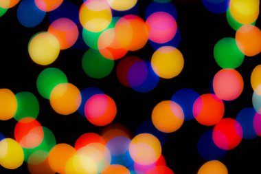 Soyut renkli, odaklanmış dairesel fakül. Bokeh bulanık renk ışığı arka planı kullanabilir. Yeni yıl Bokeh feshi