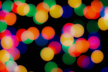 Soyut renkli, odaklanmış dairesel fakül. Bokeh bulanık renk ışığı arka planı kullanabilir. Yeni yıl Bokeh feshi