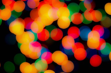 Soyut renkli, odaklanmış dairesel fakül. Bokeh bulanık renk ışığı arka planı kullanabilir. Yeni yıl Bokeh feshi