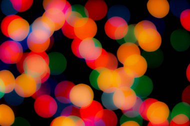 Soyut renkli, odaklanmış dairesel fakül. Bokeh bulanık renk ışığı arka planı kullanabilir. Yeni yıl Bokeh feshi