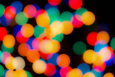 Soyut renkli, odaklanmış dairesel fakül. Bokeh bulanık renk ışığı arka planı kullanabilir. Yeni yıl Bokeh feshi