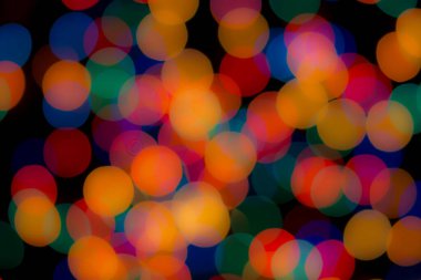 Soyut renkli, odaklanmış dairesel fakül. Bokeh bulanık renk ışığı arka planı kullanabilir. Yeni yıl Bokeh feshi