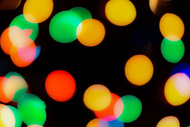 Soyut renkli, odaklanmış dairesel fakül. Bokeh bulanık renk ışığı arka planı kullanabilir. Yeni yıl Bokeh feshi