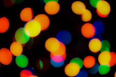 Soyut renkli, odaklanmış dairesel fakül. Bokeh bulanık renk ışığı arka planı kullanabilir. Yeni yıl Bokeh feshi