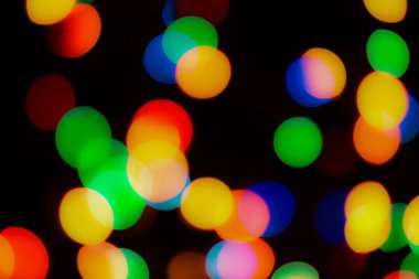 Soyut renkli, odaklanmış dairesel fakül. Bokeh bulanık renk ışığı arka planı kullanabilir. Yeni yıl Bokeh feshi