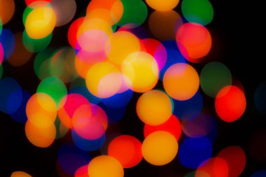 Soyut renkli, odaklanmış dairesel fakül. Bokeh bulanık renk ışığı arka planı kullanabilir. Yeni yıl Bokeh feshi