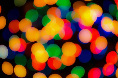 Soyut renkli, odaklanmış dairesel fakül. Bokeh bulanık renk ışığı arka planı kullanabilir. Yeni yıl Bokeh feshi