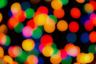 Soyut renkli, odaklanmış dairesel fakül. Bokeh bulanık renk ışığı arka planı kullanabilir. Yeni yıl Bokeh feshi