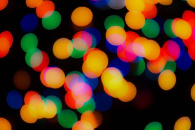 Soyut renkli, odaklanmış dairesel fakül. Bokeh bulanık renk ışığı arka planı kullanabilir. Yeni yıl Bokeh feshi