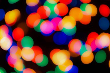 Soyut renkli, odaklanmış dairesel fakül. Bokeh bulanık renk ışığı arka planı kullanabilir. Yeni yıl Bokeh feshi