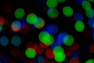 Soyut renkli, odaklanmış dairesel fakül. Bokeh bulanık renk ışığı arka planı kullanabilir. Yeni yıl Bokeh feshi