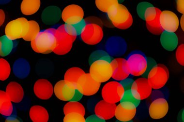 Soyut renkli, odaklanmış dairesel fakül. Bokeh bulanık renk ışığı arka planı kullanabilir. Yeni yıl Bokeh feshi