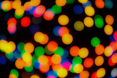 Soyut renkli, odaklanmış dairesel fakül. Bokeh bulanık renk ışığı arka planı kullanabilir. Yeni yıl Bokeh feshi