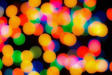 Soyut renkli, odaklanmış dairesel fakül. Bokeh bulanık renk ışığı arka planı kullanabilir. Yeni yıl Bokeh feshi