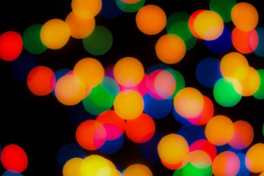 Soyut renkli, odaklanmış dairesel fakül. Bokeh bulanık renk ışığı arka planı kullanabilir. Yeni yıl Bokeh feshi