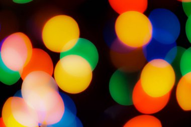 Soyut renkli, odaklanmış dairesel fakül. Bokeh bulanık renk ışığı arka planı kullanabilir. Yeni yıl Bokeh feshi