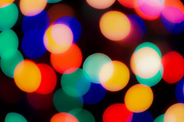 Soyut renkli, odaklanmış dairesel fakül. Bokeh bulanık renk ışığı arka planı kullanabilir. Yeni yıl Bokeh feshi