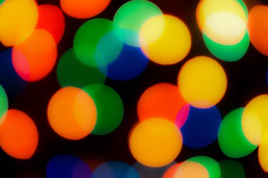 Soyut renkli, odaklanmış dairesel fakül. Bokeh bulanık renk ışığı arka planı kullanabilir. Yeni yıl Bokeh feshi